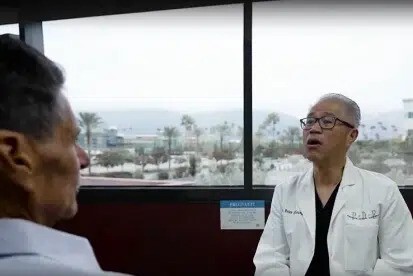 upland dentist discussing emergency dental concerns with patient